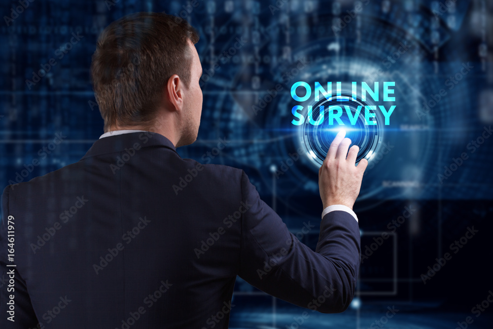 Business, Technology, Internet and network concept. Young businessman working on a virtual screen of the future and sees the inscription: Online survey Business, Technology, Internet and network concept. Young businessman working on a virtual screen of the future and sees the inscription: Online survey