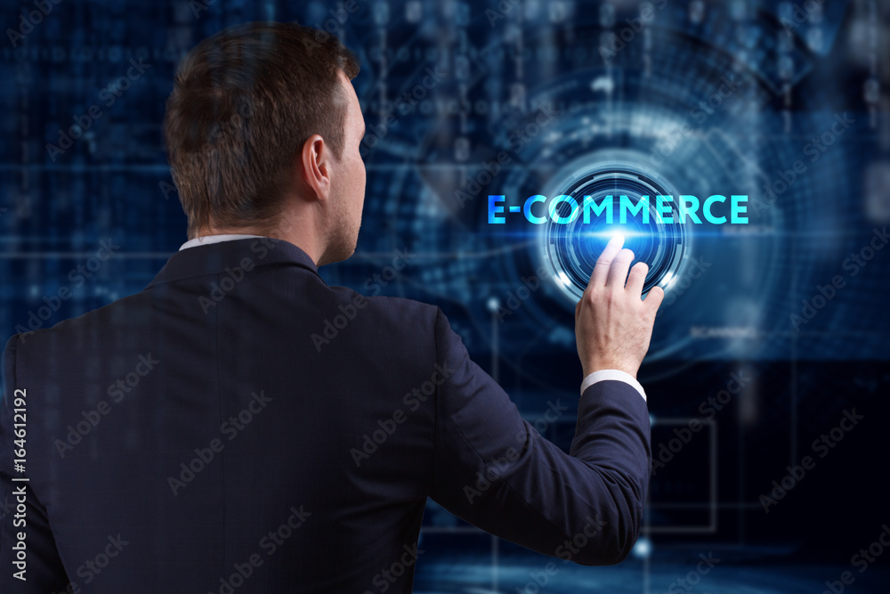 Business, Technology, Internet and network concept. Young businessman working on a virtual screen of the future and sees the inscription: E-commerce
