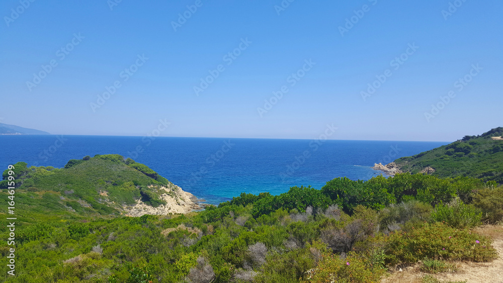 Beautiful beach on Skiathos island in Greece, windy summer day in June