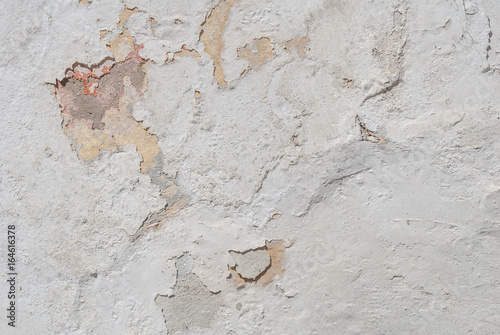 white texture, old chipped plaster on the concrete wall, background
