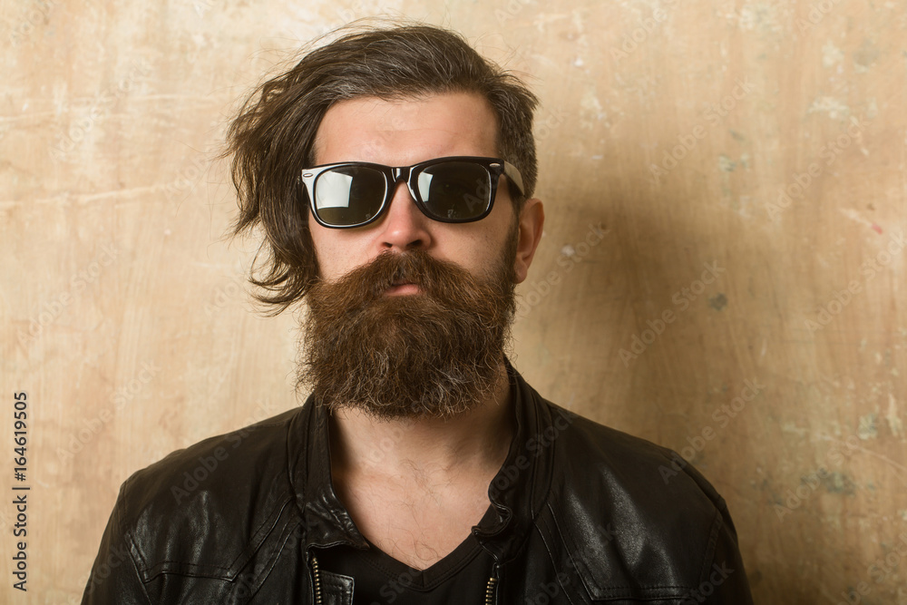 Hipster in leather jacket and glasses. Hipster in leather jacket and glasses.