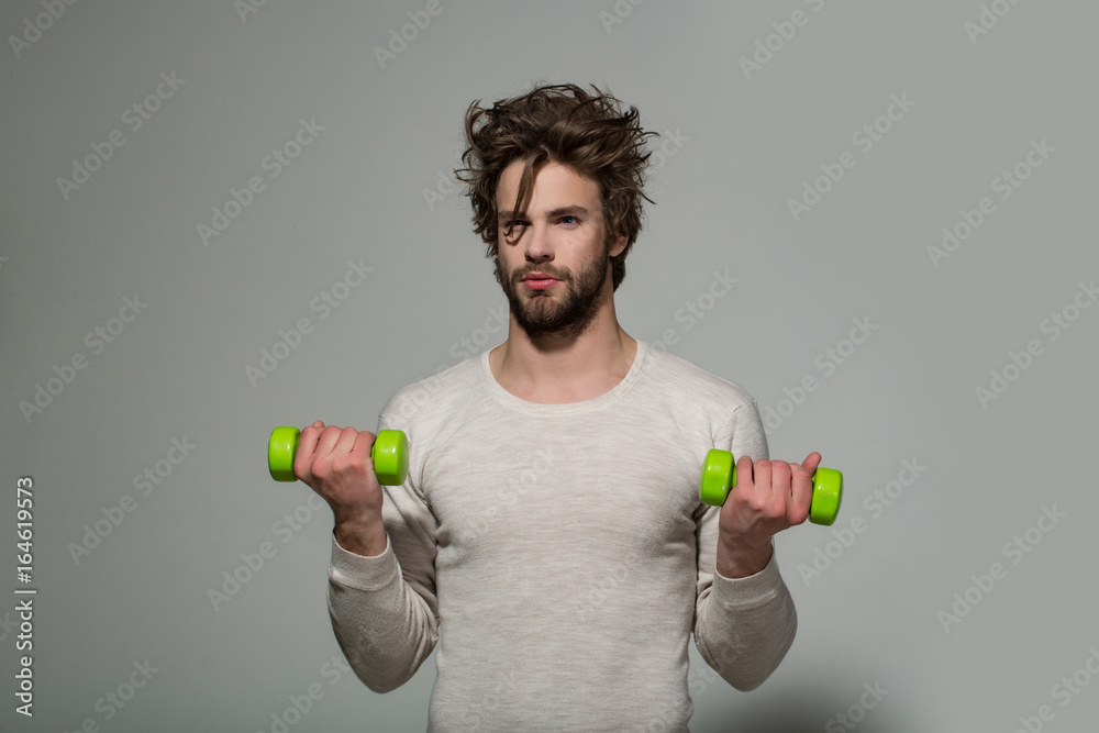 man with barbell doing morning exercise, has uncombed hair man with barbell doing morning exercise, has uncombed hair