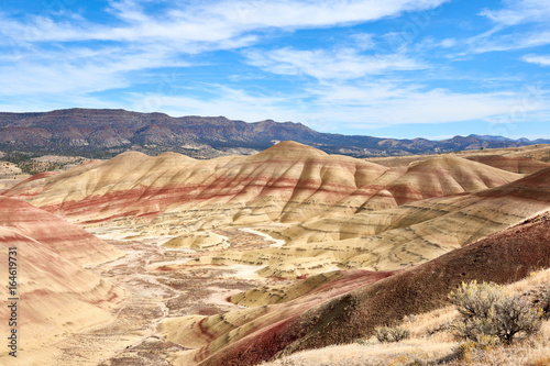 Surrealistic landscape of the slopes of Painted Hills in the John Day Fossil Beds National Monument. View from hiking trail.