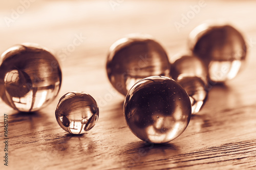 Glass balls of different sizes tinted in gold.