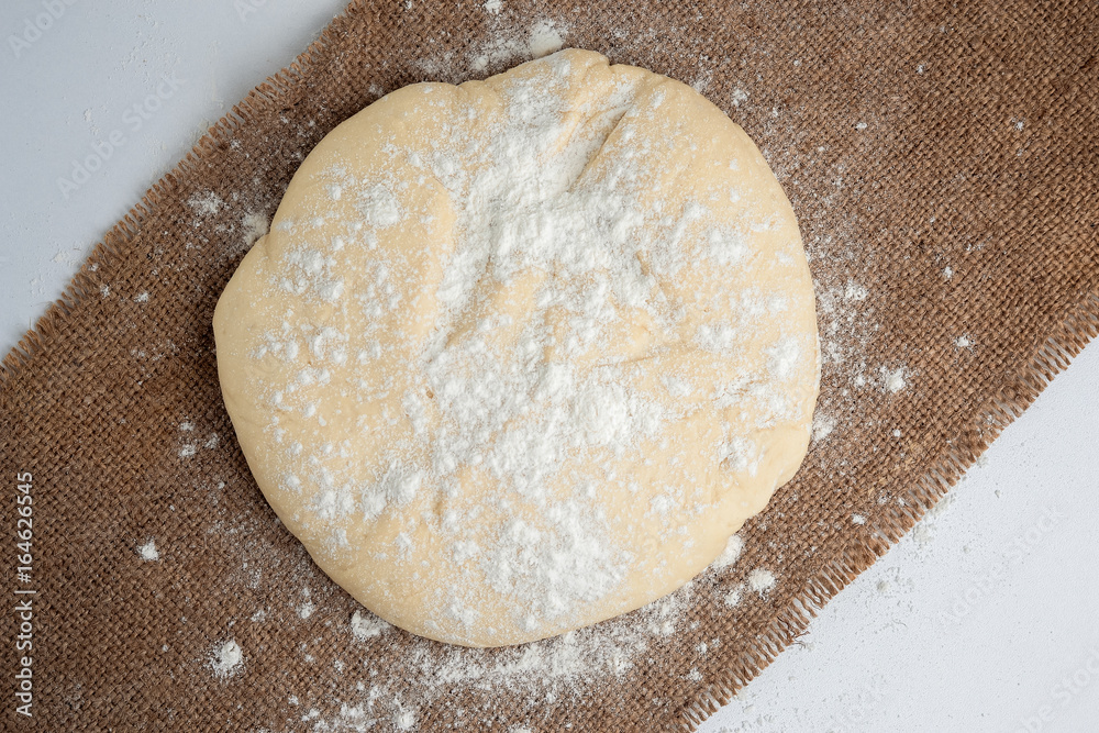 Ball of dough for pizza on the background of rustic Ball of dough for pizza on the background of rustic