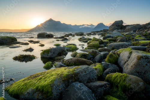 Sunset view of Black Cuillin mountains from rocky Elgol beach photo