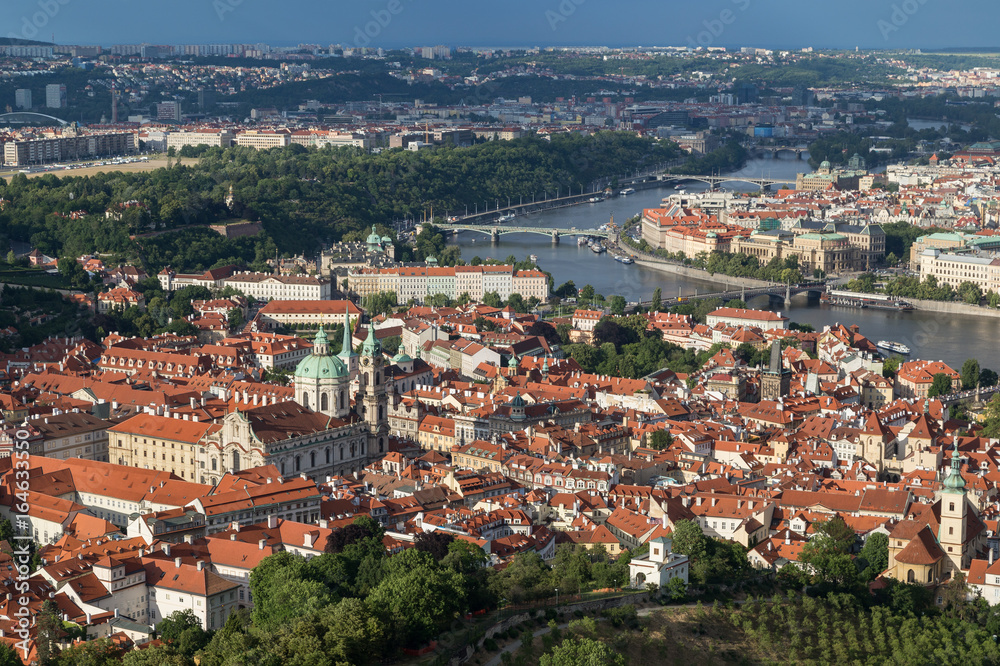View of St. Nicholas Church at the Mala Strana District (Lesser Town) and Vltava River in Prague, Czech Republic, from above.