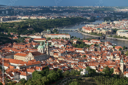 View of St. Nicholas Church at the Mala Strana District (Lesser Town) and Vltava River in Prague, Czech Republic, from above.