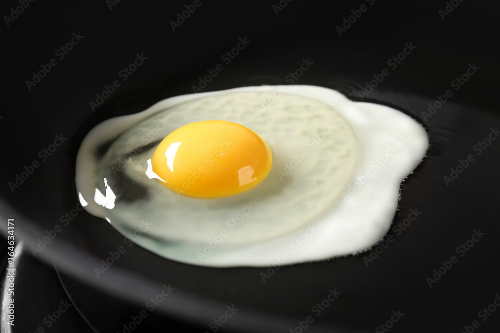 Delicious over easy egg in pan, closeup Delicious over easy egg in pan, closeup