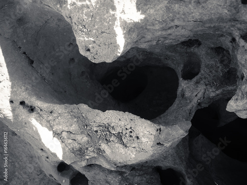 Macro closeup on surface of the rock stone dark background