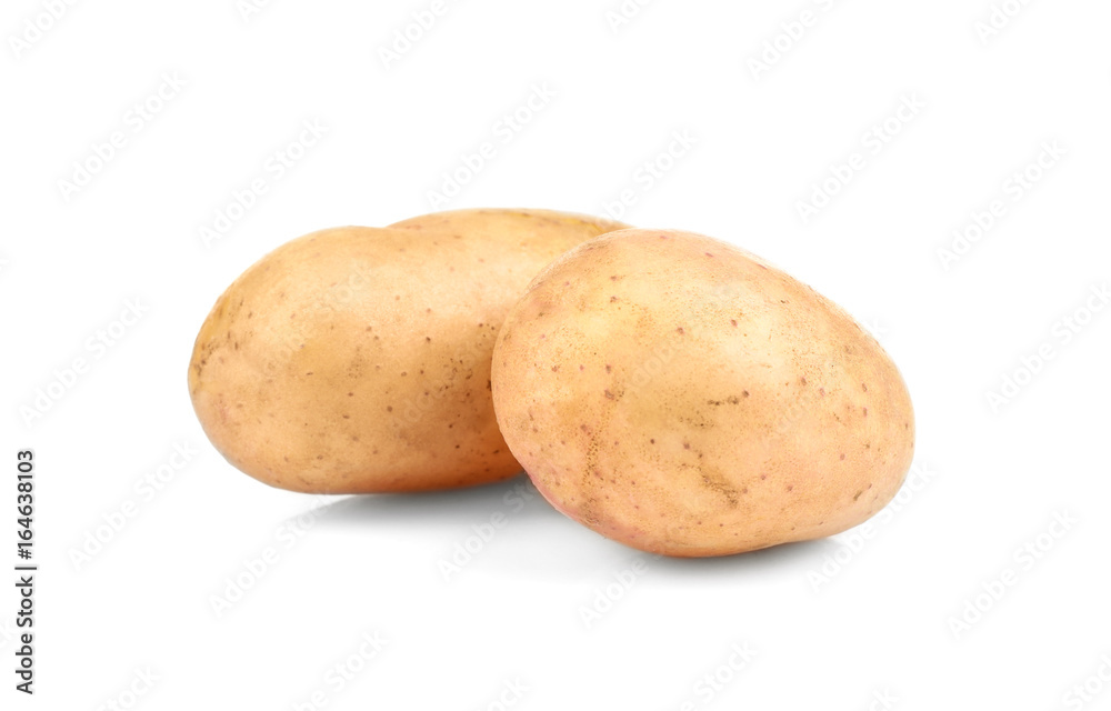 Raw unpeeled potatoes on white background Raw unpeeled potatoes on white background