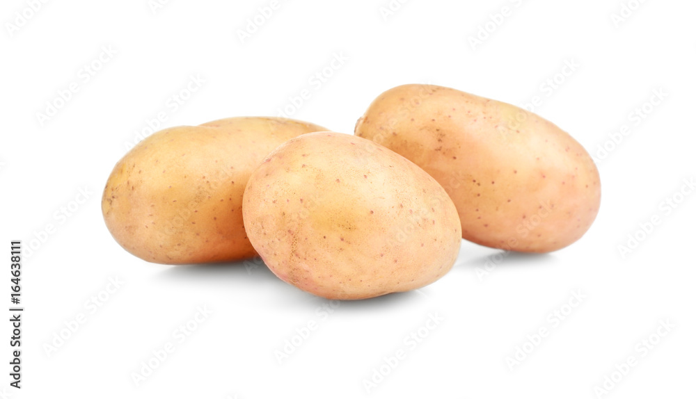 Raw unpeeled potatoes on white background Raw unpeeled potatoes on white background