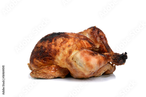 baked rotisserie chicken dinner on white background