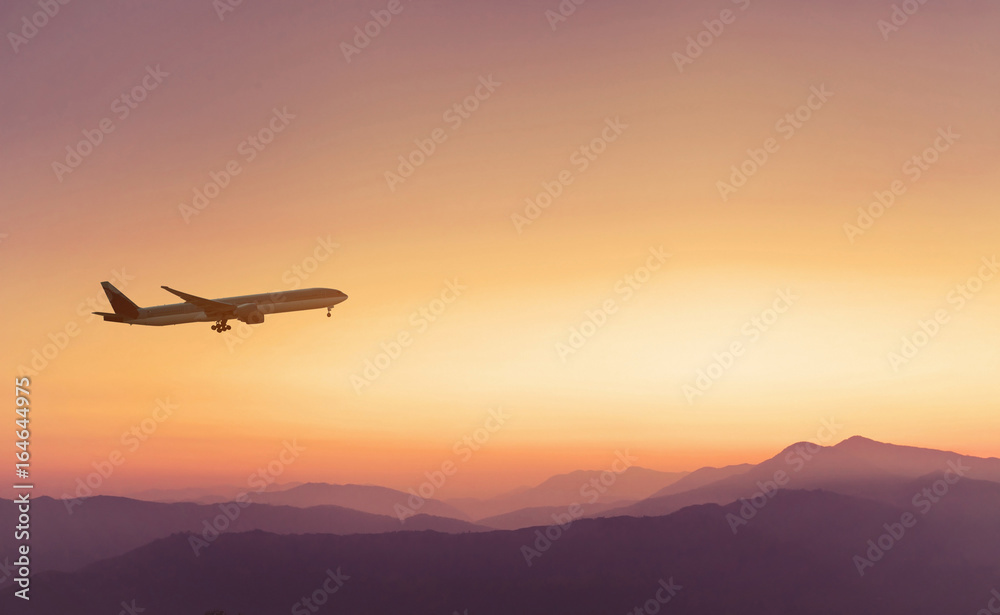 Naklejka premium travel concept background, airplane in sunset sky, international flight