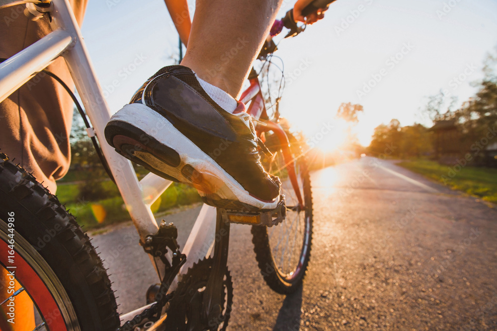 cycling outdoors, close up of the feet on pedal - obrazy, fototapety, plakaty 