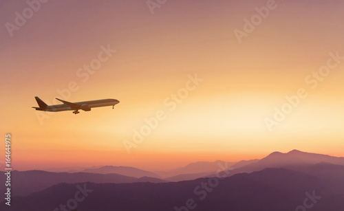travel concept background, airplane in sunset sky, international flight
