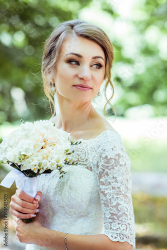 Bouquet in bride's hands photo