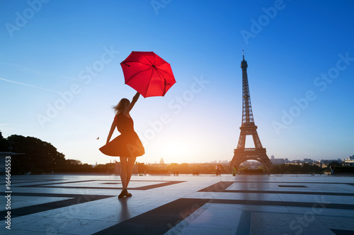 Canvas Print travel to Paris, silhouette of beautiful girl with red umbrella near Eiffel Towe