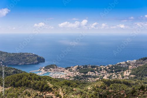 Puerto de Soller, Port of Mallorca island in balearic islands, Spain. Beautiful beach and bay with boats in clear blue water of summer day.