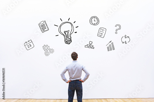 idea or innovation concept, businessman looking at the sketch on white background