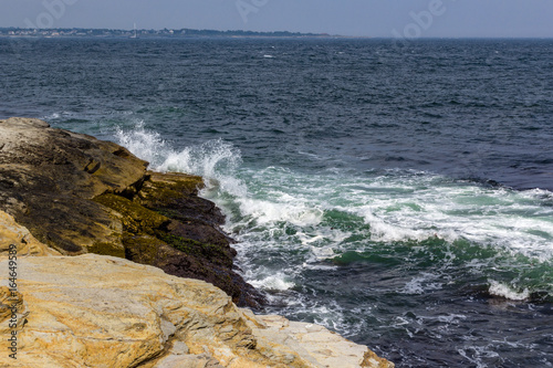 Wves crashing against rocky shore in Jamestown Rhode Island