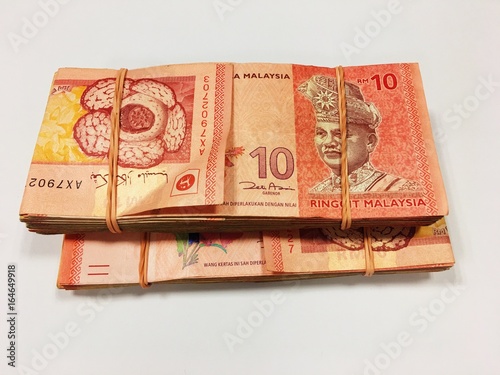 Malaysia Currency (MYR): Stack of Ringgit Malaysia bank note with isolated white background. There are ten and twenty ringgit Malaysia.