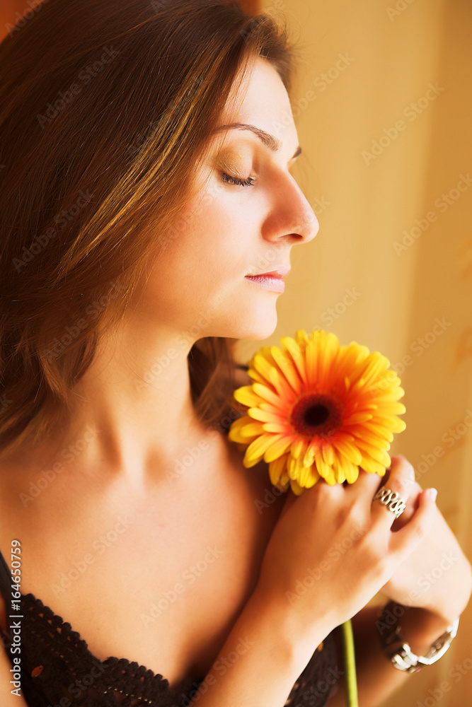 Woman Smelling Flower