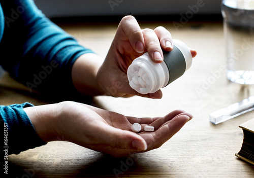 Adult Taking Medication Supplements Vitamins photo