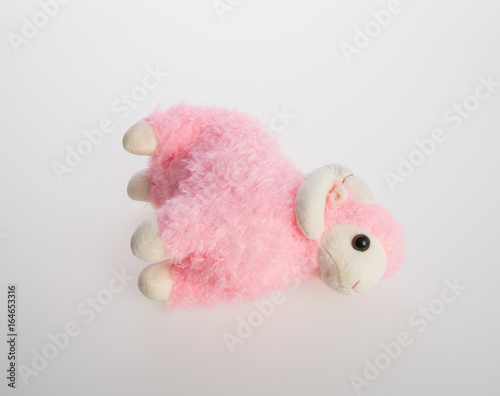 toy or goat or sheep on a background. © heinteh