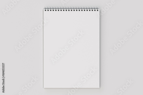 Blank white notebook with metal spiral bound on white background