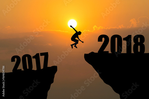 man jumping from 2017 to 2018