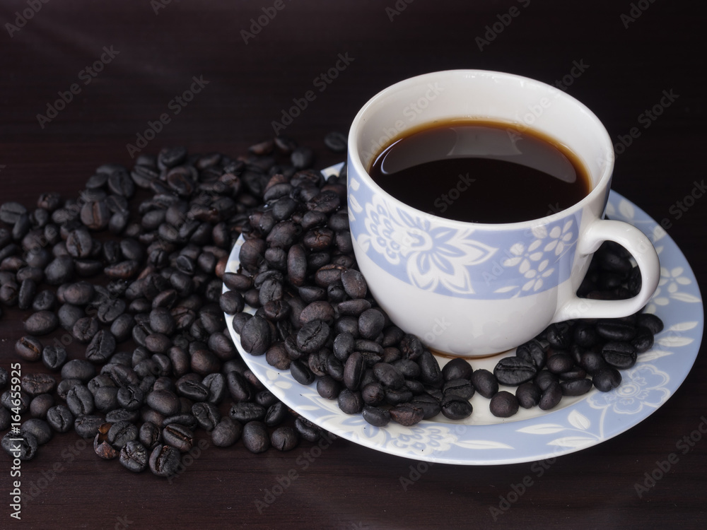 Coffee in cup with coffee beans around. Coffee in cup with coffee beans around.