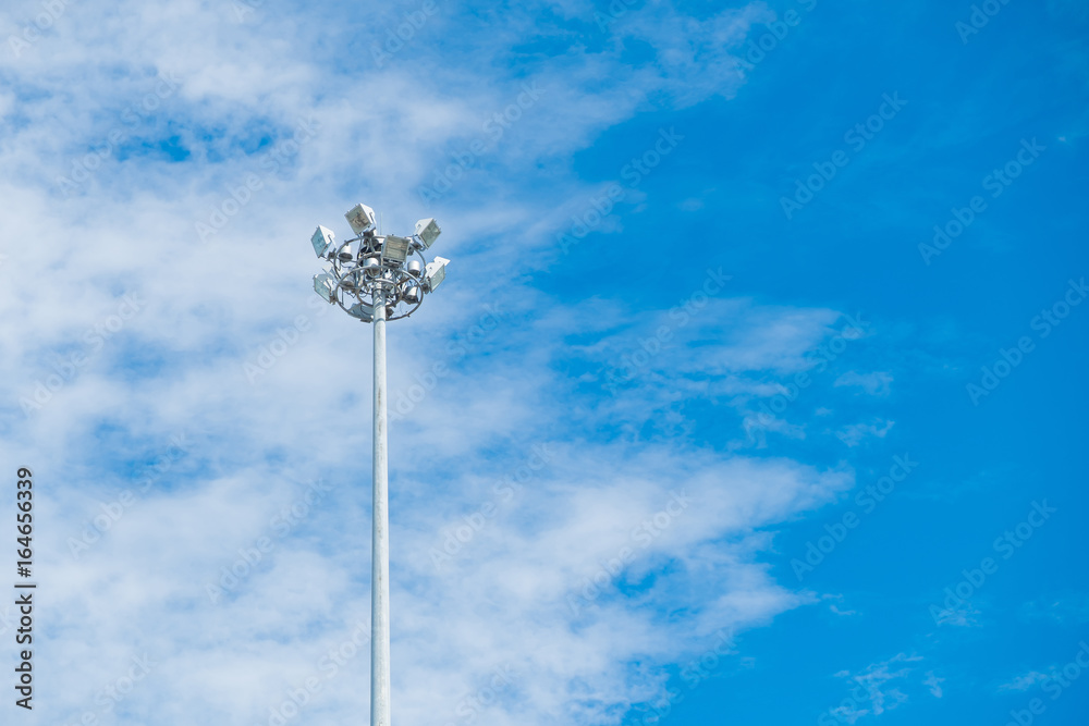 Lamp post electricity industry with blue sky background. Spotlight tower,