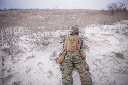 Soldiers from US Navy Amphibious Squadron 8 assault an enemy strong point during a NATO military exercise photo