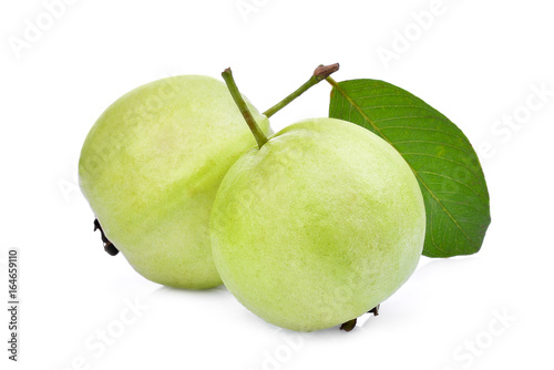 two whole guava fruit with green leaf isolated on white background