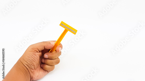 Man hand hold two knives razor in yellow color