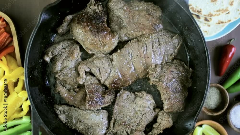 Step by step. Frying beef flank steak in cast iron frying pan for steak