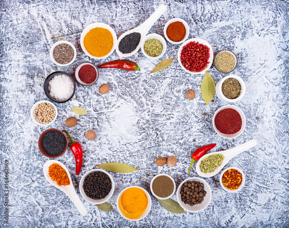 Variety of spices and herbs for cooking meat, fish, chicken and vegetable salads Variety of spices and herbs for cooking meat, fish, chicken and vegetable salads