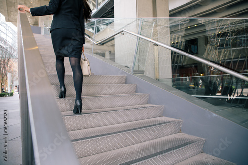 young businesswoman going up the stairs.