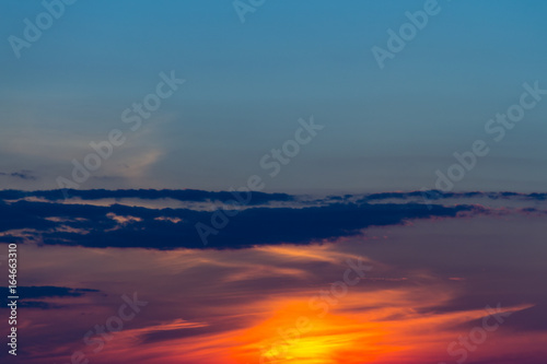 Beautiful orange sunset sky. Natural background © olyasolodenko