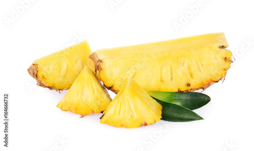 Pieces of pineapple fruits with green leaf isolated on white background
