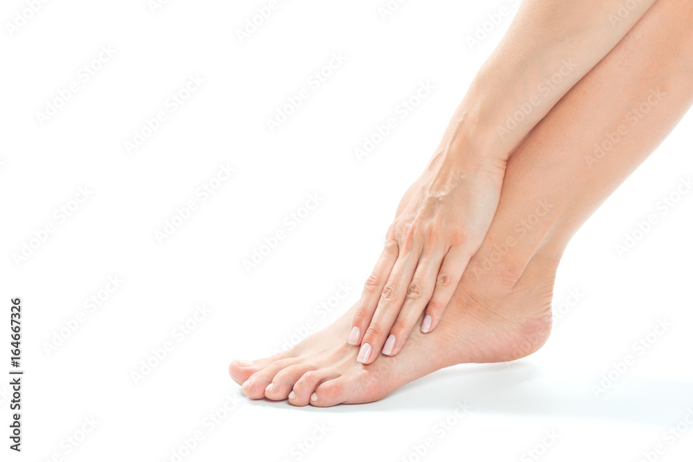 Beautiful women feet isolated on white close-up Beautiful women feet isolated on white close-up