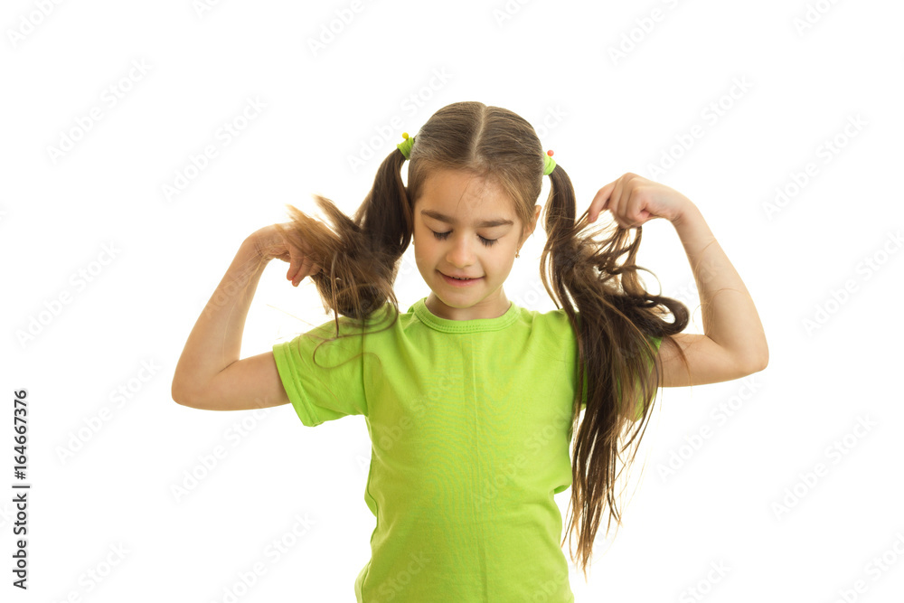 funny little girl with pigtails in green shirt funny little girl with pigtails in green shirt
