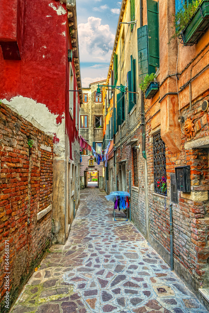 Fototapeta premium Colorful street in the Italian Venice.
