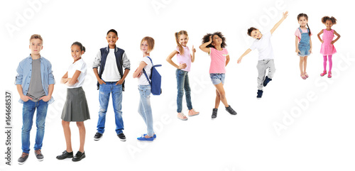 Foto Schoolchildren of different ages on white background