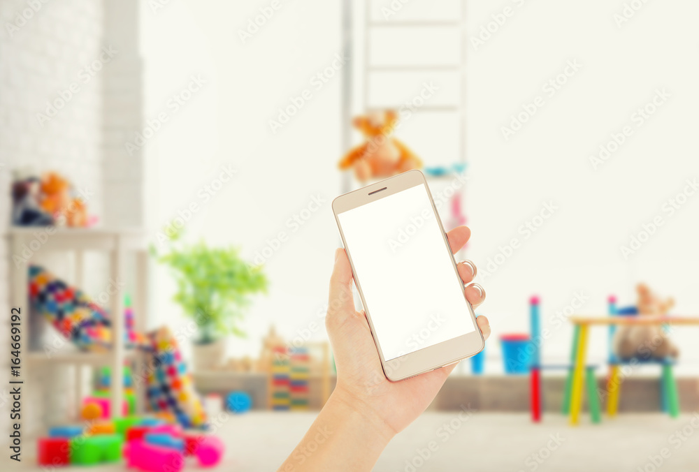 Fotografie Hand holding smart phone on white background