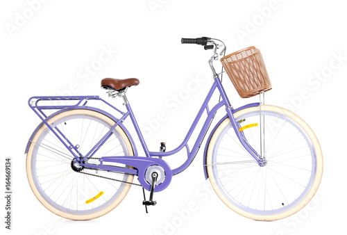 Modern bicycle with basket on white background