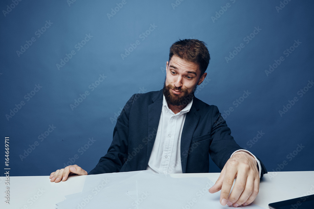 Business man with a beard working at his desk in the office Business man with a beard working at his desk in the office