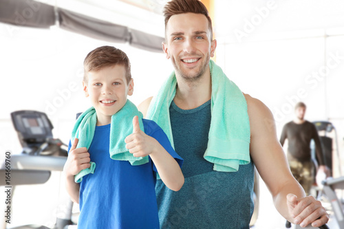 Dad and son in gym