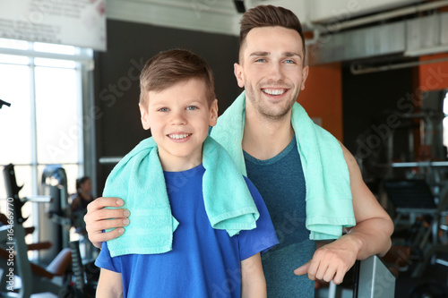 Dad and son in gym